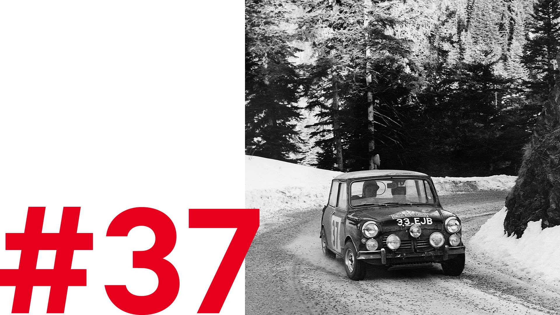 Monte Carlo Rally Mini competitor with plates 33 EJB takes a curve on the daring course.